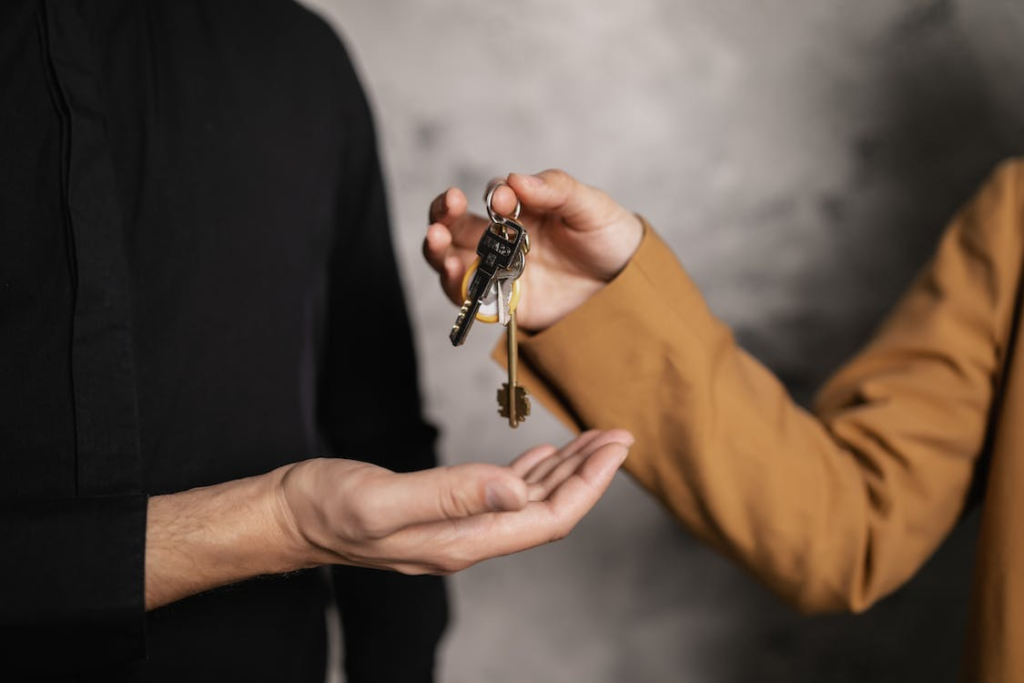 Handing house keys to a tenant